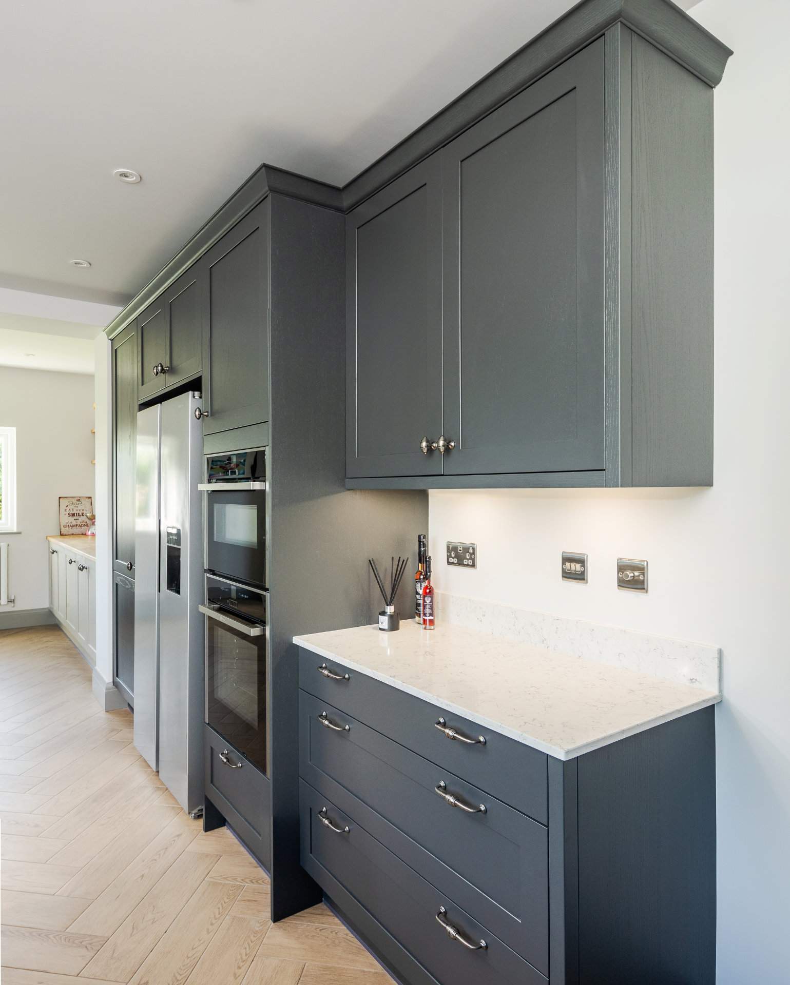 The dark grey cabinets