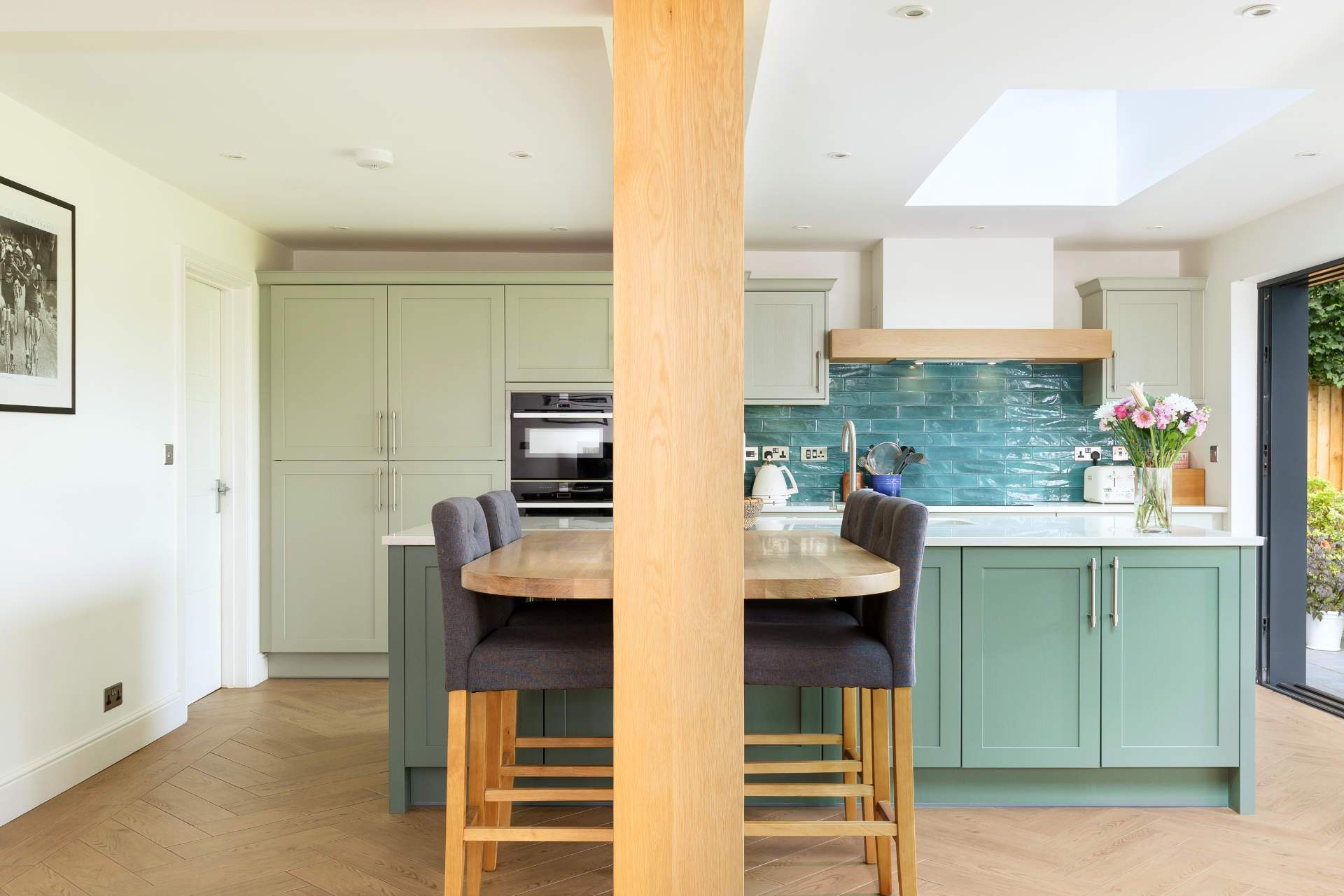 Vertical support pilar clad in solid oak panels